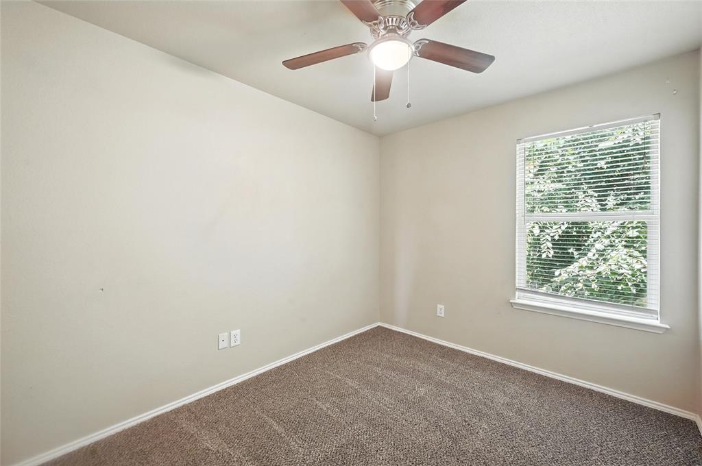 1321 Village Garden Azle, TX 76020 - Photo 10 of 20 an empty room with a window and a fan
