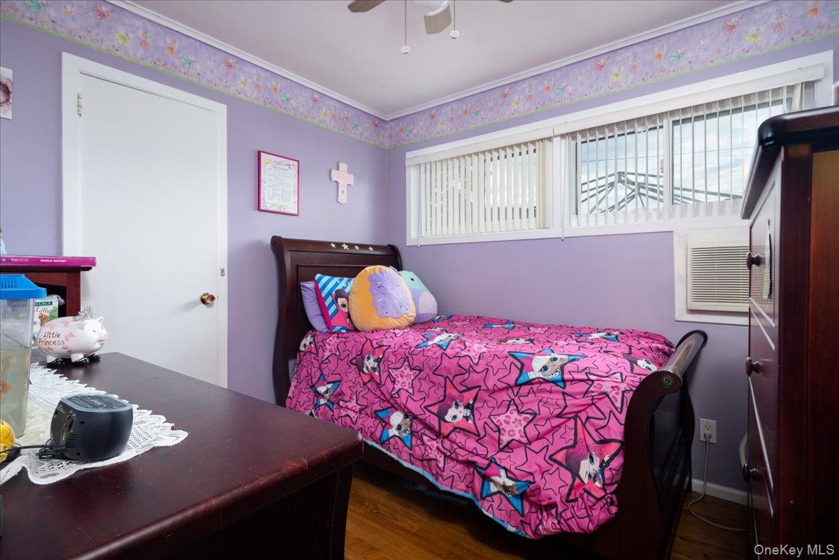 11 Adelphi Road Hicksville, NY 11801 - Photo 15 of 26 a bedroom with a bed and a window