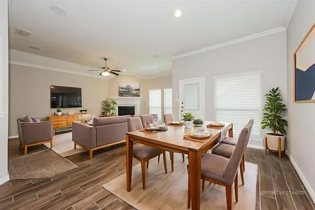 a view of a dining room with furniture window and wooden floor