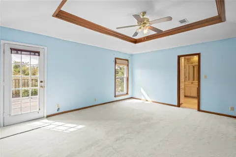 a bathroom with a tub shower and sink