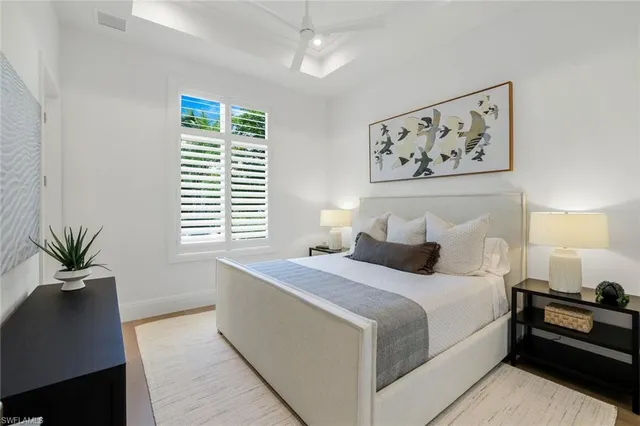 a bedroom with a large bed and a couch