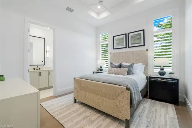 a bedroom with a bed and dresser