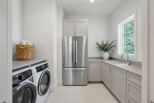 a kitchen with a refrigerator and a sink