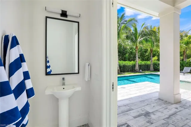 a bathroom with a sink and mirror