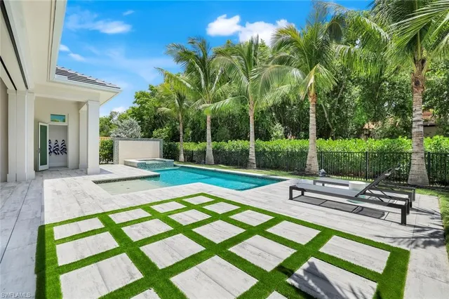 a view of a patio with a table and chairs