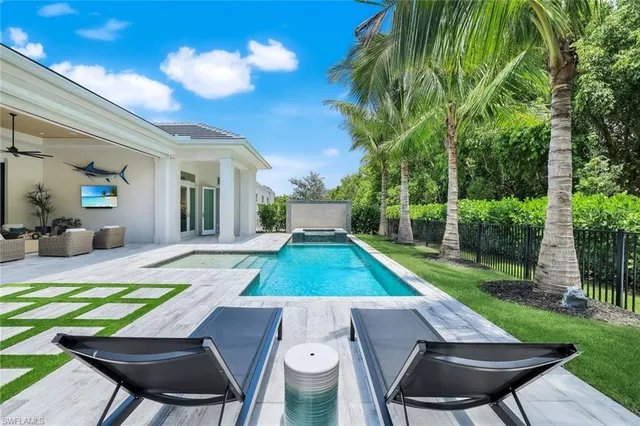 a view of a backyard with sitting area