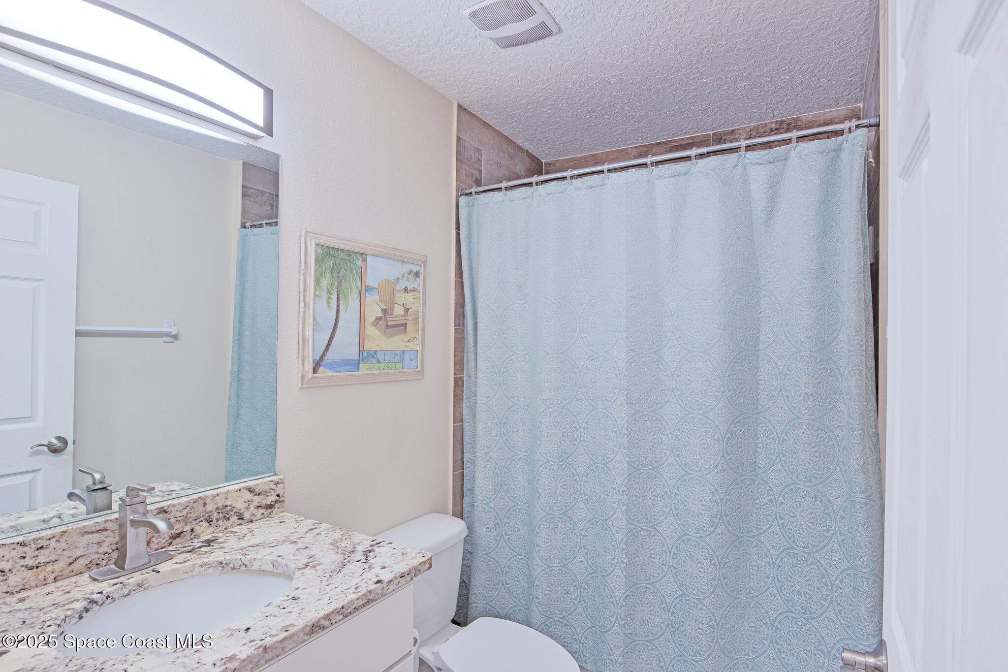 7350 Barbara Road Cocoa, FL 32927 - Photo 18 of 26 a bathroom with a sink and a mirror