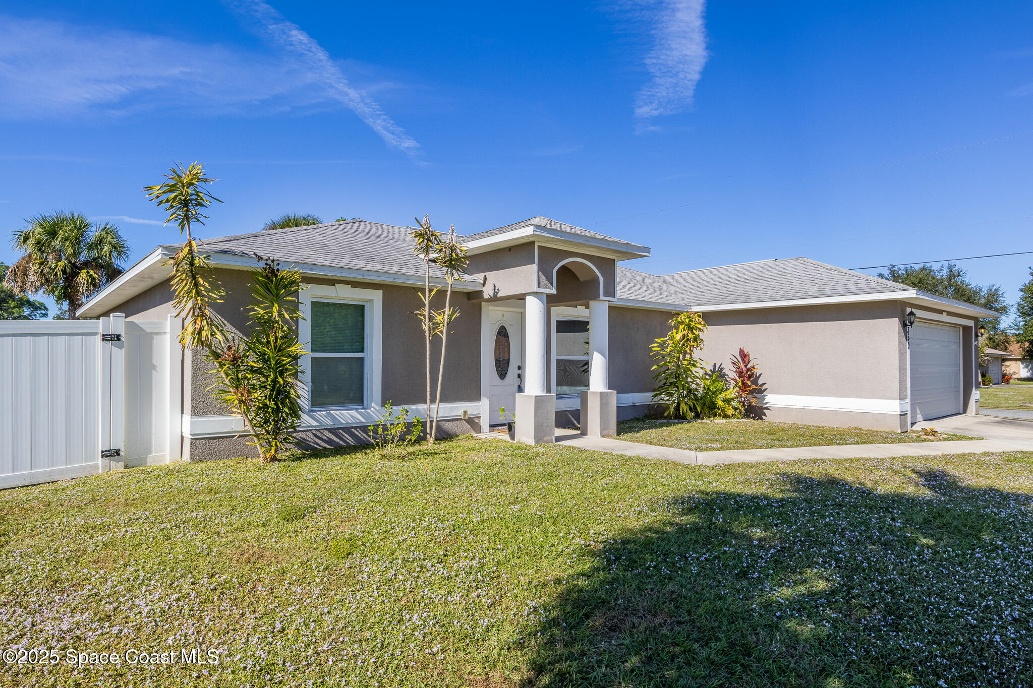 7350 Barbara Road Cocoa, FL 32927 - Photo 18 of 26 a front view of a house with a yard