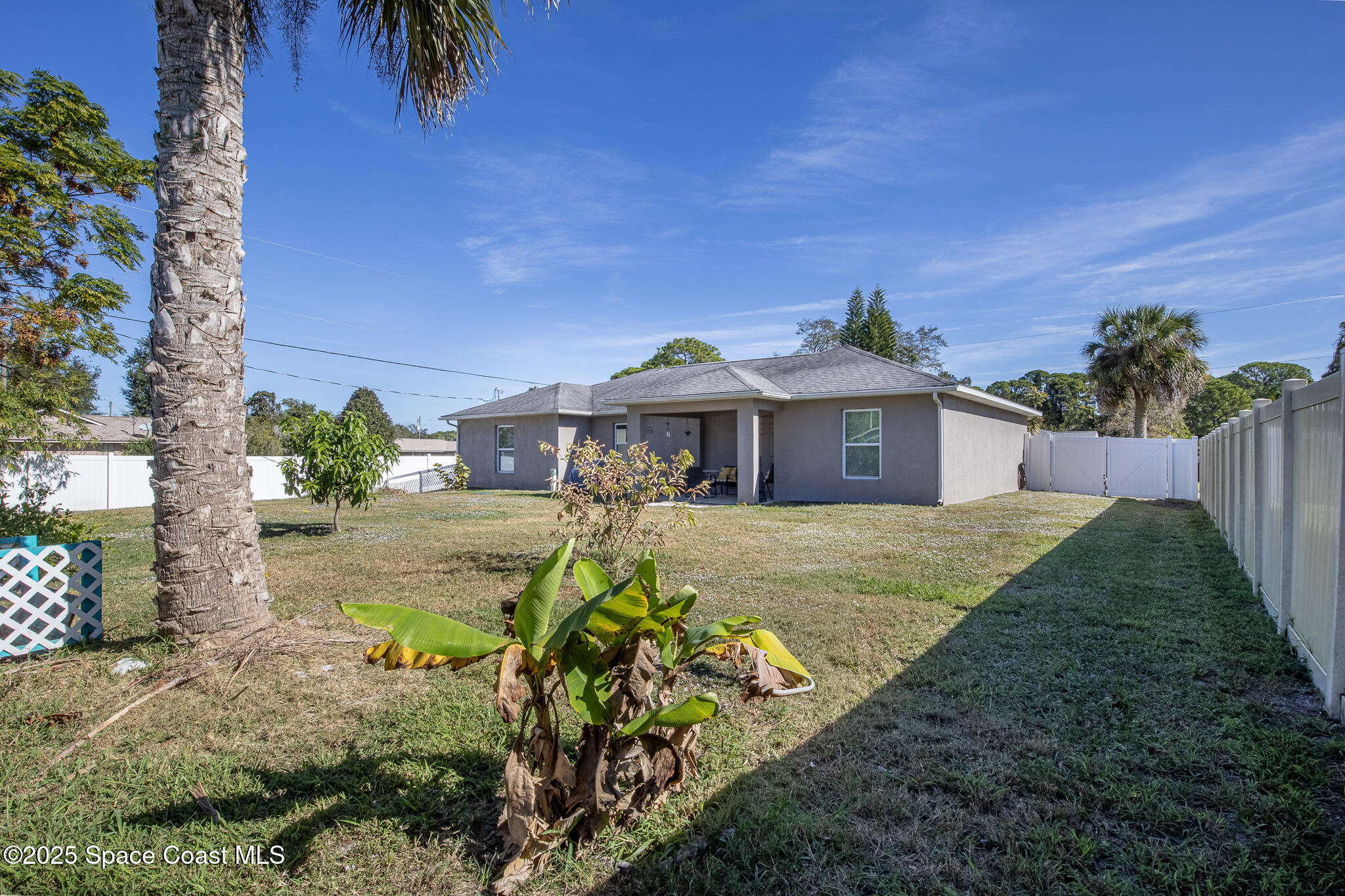 7350 Barbara Road Cocoa, FL 32927 - Photo 19 of 26 a front view of a house with a yard