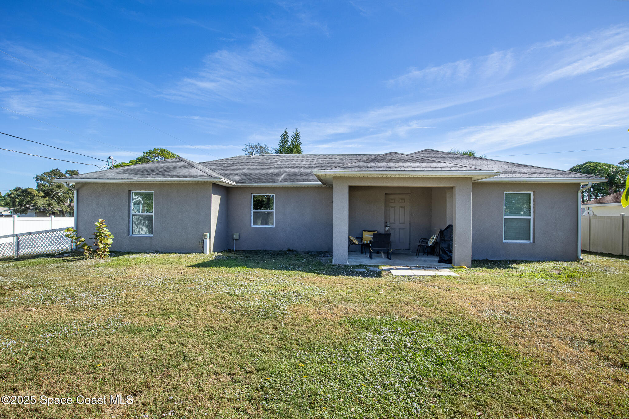 7350 Barbara Road Cocoa, FL 32927 - Photo 22 of 26 a view of a house with a garden and yard