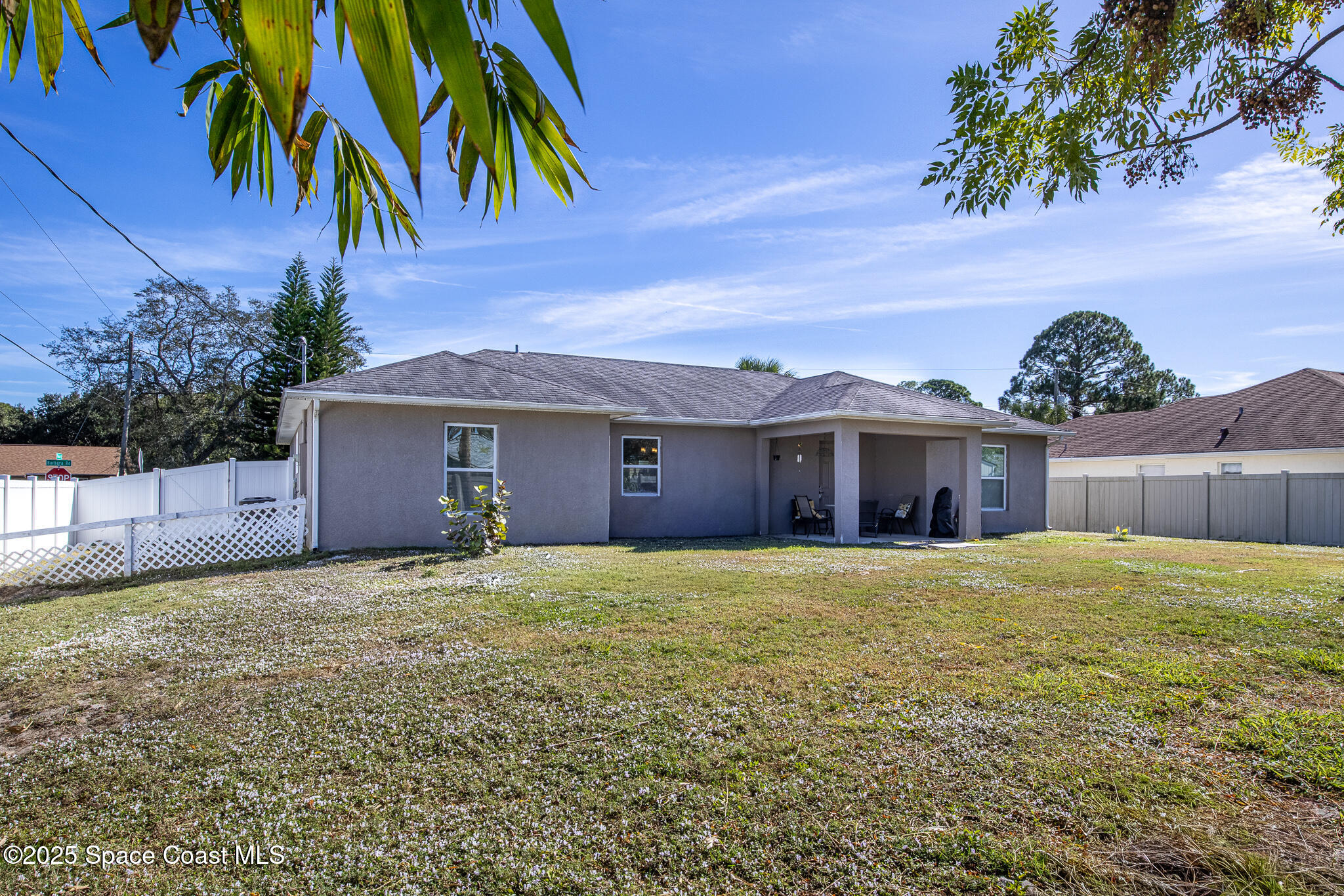 7350 Barbara Road Cocoa, FL 32927 - Photo 24 of 26 a house with yard and a outdoor space