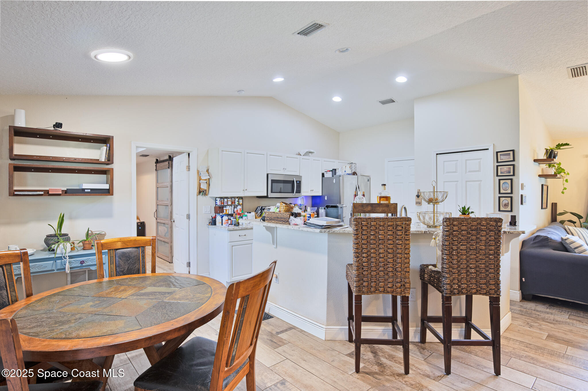 7350 Barbara Road Cocoa, FL 32927 - Photo 25 of 26 a dining room with furniture and window