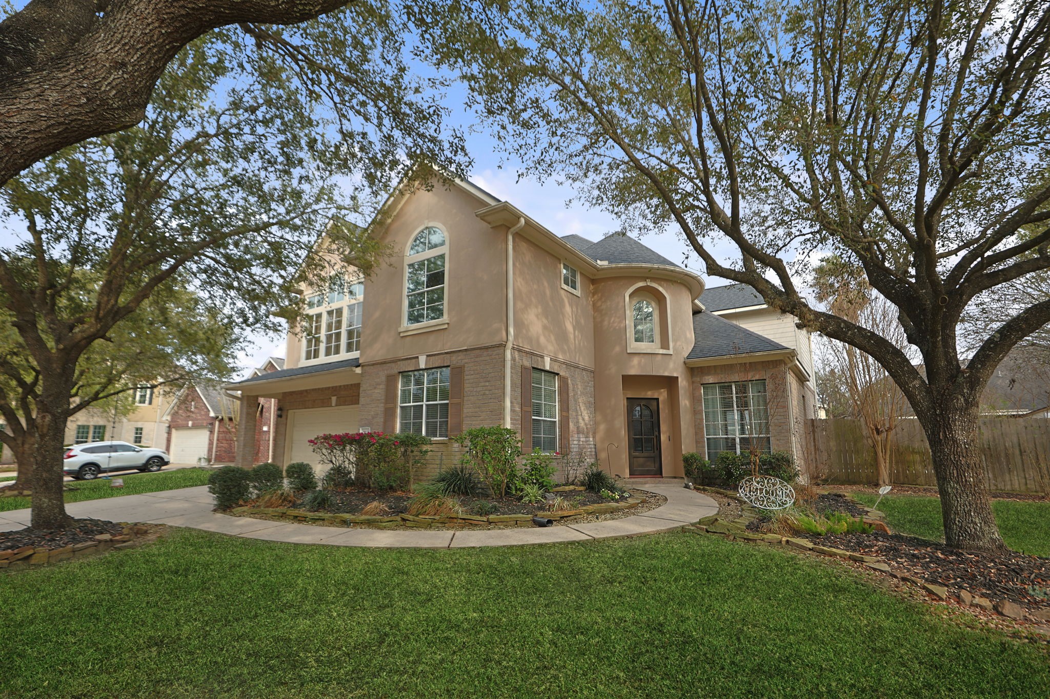 20102 Windbury Court Spring, TX 77379 - Photo 1 of 49 a front view of a house with a yard and trees