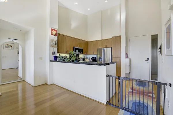 a kitchen with stainless steel appliances granite countertop a stove and a sink