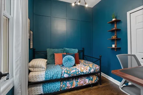 a bedroom with a bed and cabinets