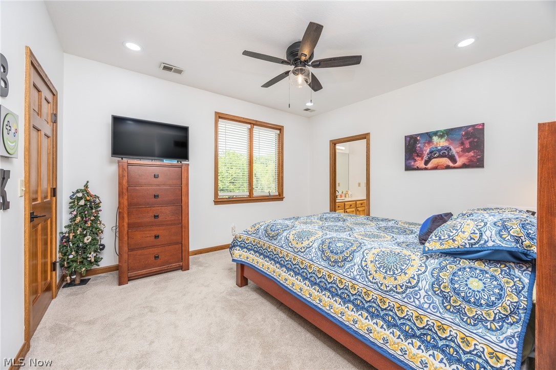 1602 Glendale Road, Unit 3 Marietta, OH 45750 - Photo 26 of 49 Carpeted room featuring a ceiling fan with integrated lighting, a window with horizontal blinds, and a wood-finish door with dark hardware