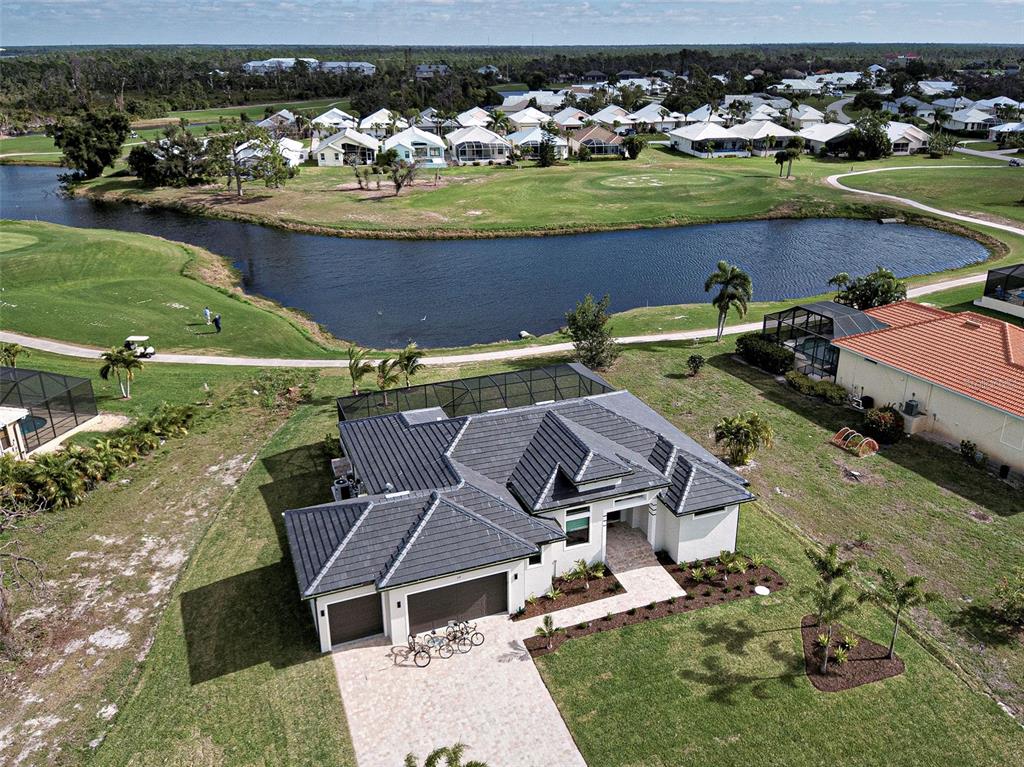 an aerial view of a house with a ocean view
