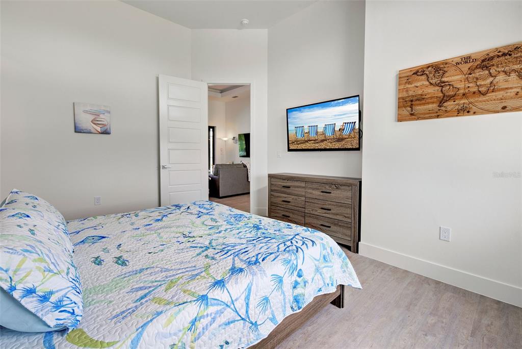 19 Windward Road Placida, FL 33946 - Photo 17 of 56 a bedroom with a bed and a flat screen tv