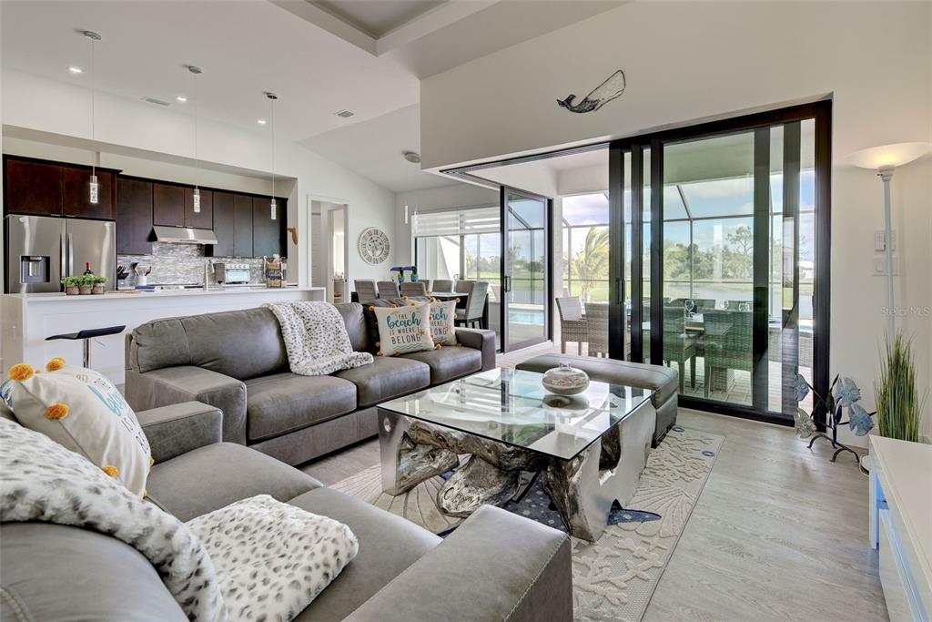 19 Windward Road Placida, FL 33946 - Photo 20 of 56 a living room with furniture and floor to ceiling windows