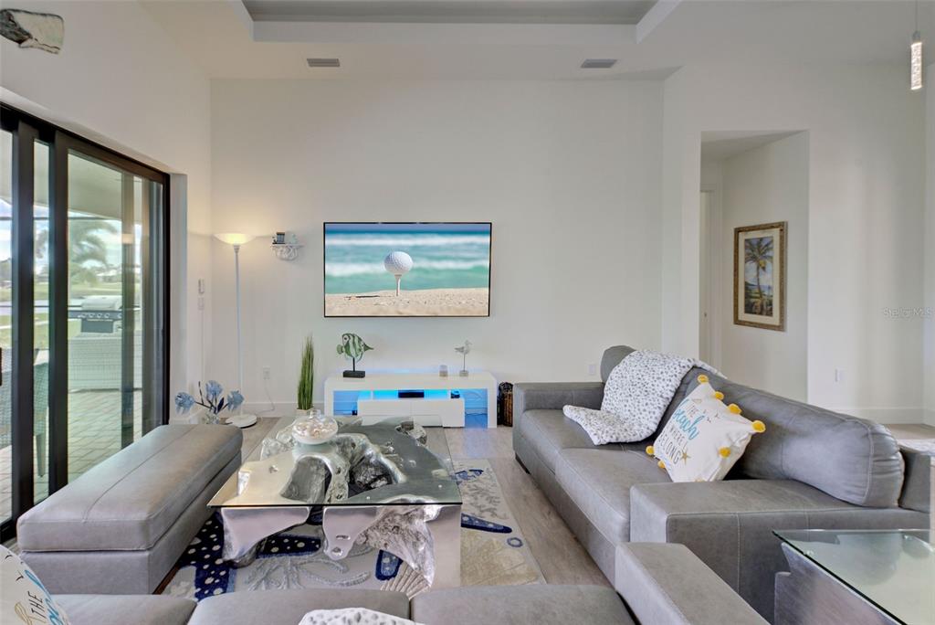 19 Windward Road Placida, FL 33946 - Photo 22 of 56 a bedroom with a bed and wooden floor