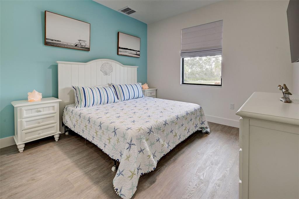 19 Windward Road Placida, FL 33946 - Photo 32 of 56 a bedroom with a bed and a desk