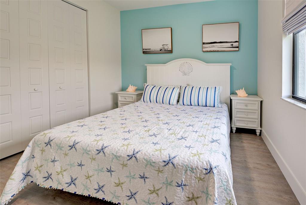 19 Windward Road Placida, FL 33946 - Photo 33 of 56 a bedroom with a bed and painting on the wall