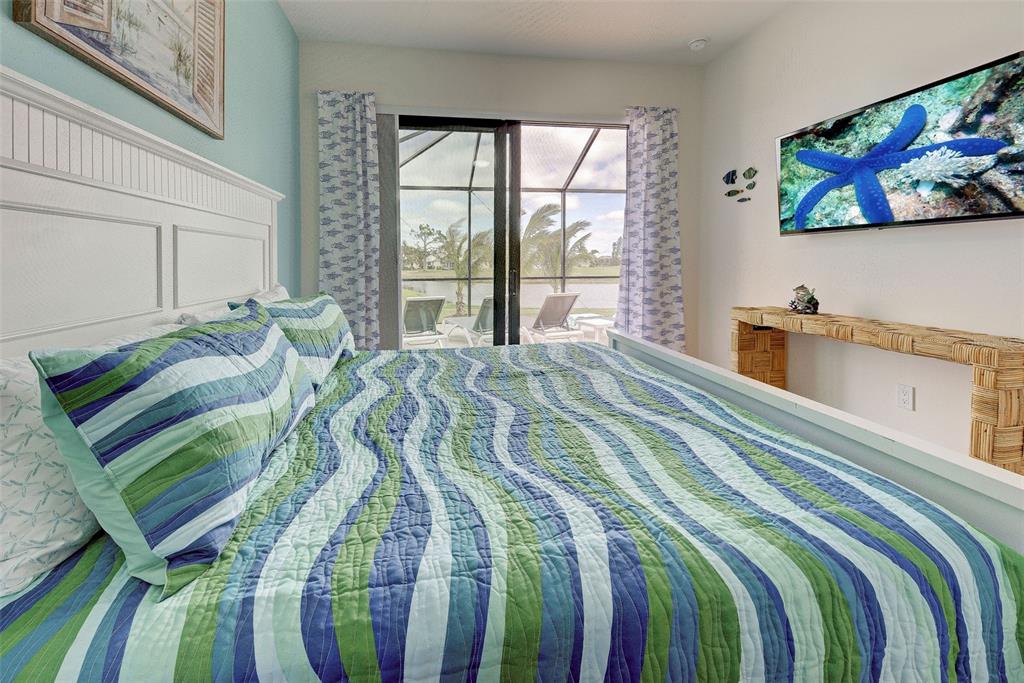 19 Windward Road Placida, FL 33946 - Photo 35 of 56 a bed sitting in a bedroom next to a window