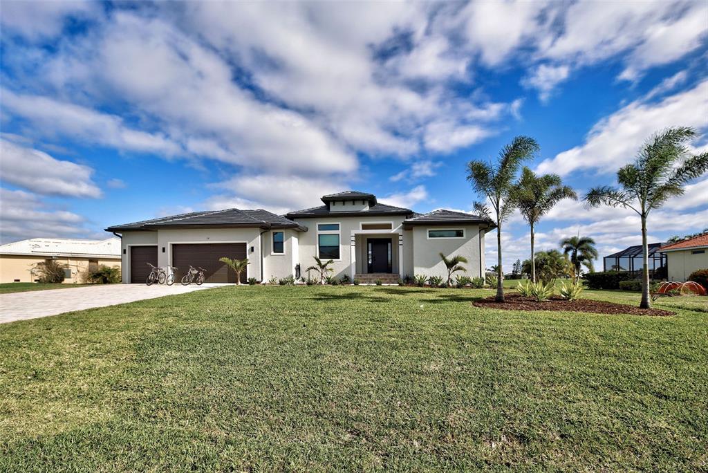 19 Windward Road Placida, FL 33946 - Photo 35 of 55 a front view of a house with a garden