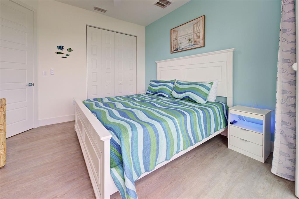 19 Windward Road Placida, FL 33946 - Photo 36 of 56 a bedroom with a bed and a window