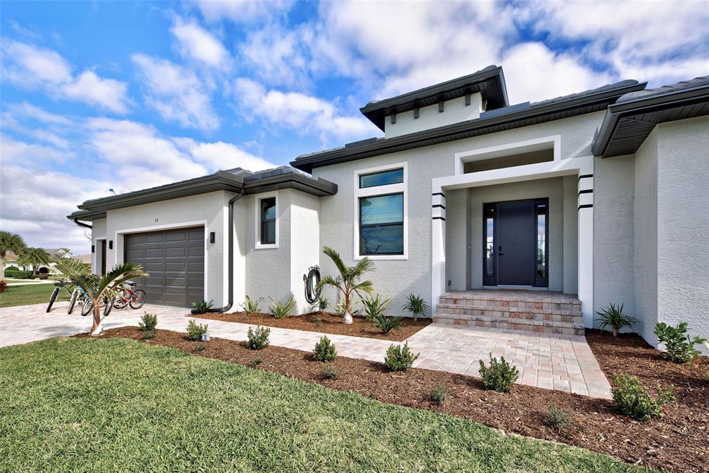 19 Windward Road Placida, FL 33946 - Photo 37 of 55 a front view of a house with a yard