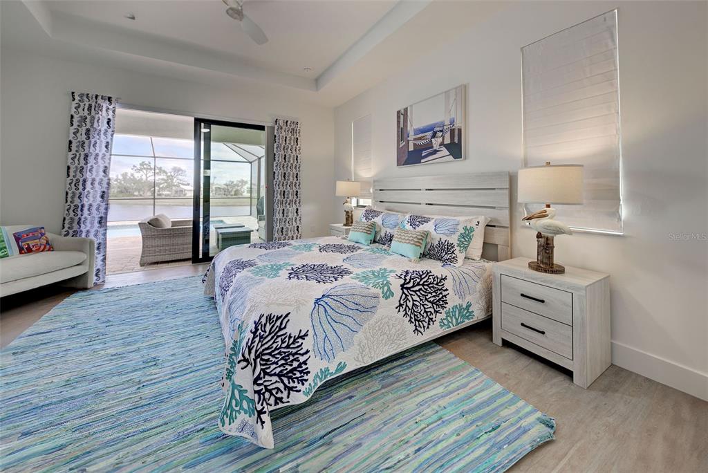 19 Windward Road Placida, FL 33946 - Photo 38 of 56 a bedroom with a bed and a large window