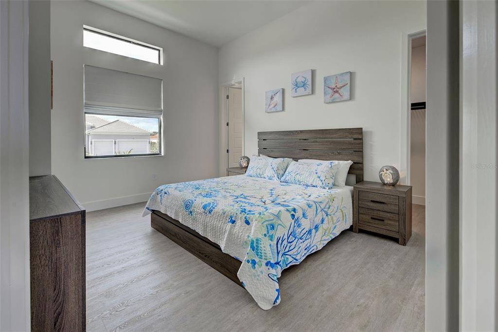19 Windward Road Placida, FL 33946 - Photo 40 of 55 a bedroom with a bed and window