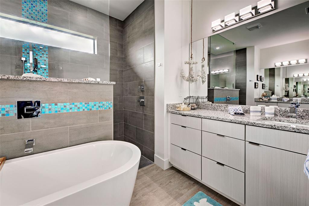 19 Windward Road Placida, FL 33946 - Photo 46 of 56 a bathroom with a bathtub a sink and a mirror