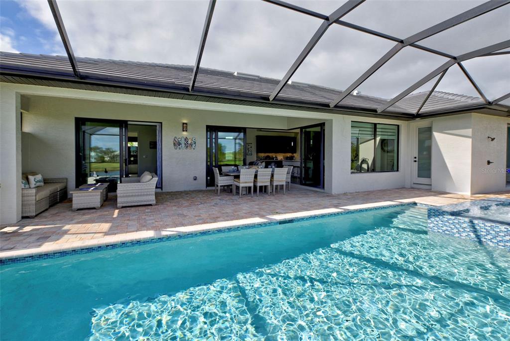 19 Windward Road Placida, FL 33946 - Photo 8 of 55 a view of a patio with table and chairs and potted plants