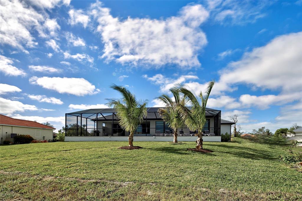 19 Windward Road Placida, FL 33946 - Photo 8 of 56 a view of a big yard in front of the house