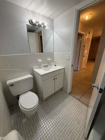 a bathroom with a bathtub and toilet