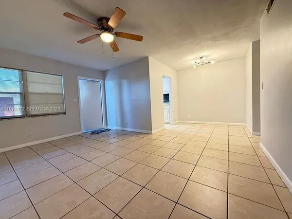 a view of an empty room and window