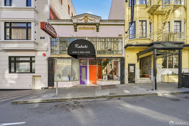 a front view of a building with parking