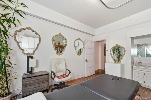 a dining room with furniture and a window