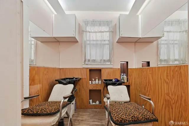 a view of a dining room with furniture wooden floor and windows