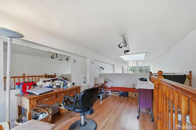 a view of a hallway with seating area