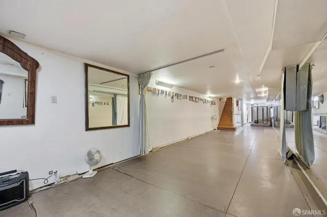 a view of a bathroom with wooden floor and a tub