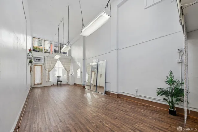 a kitchen with a refrigerator and cabinets