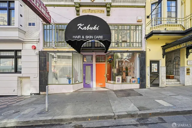 a front view of a building with retail shops