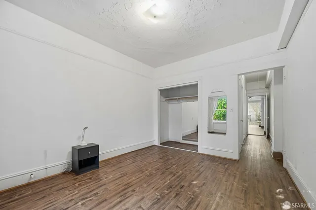 a bathroom with a granite countertop sink a mirror and a shower