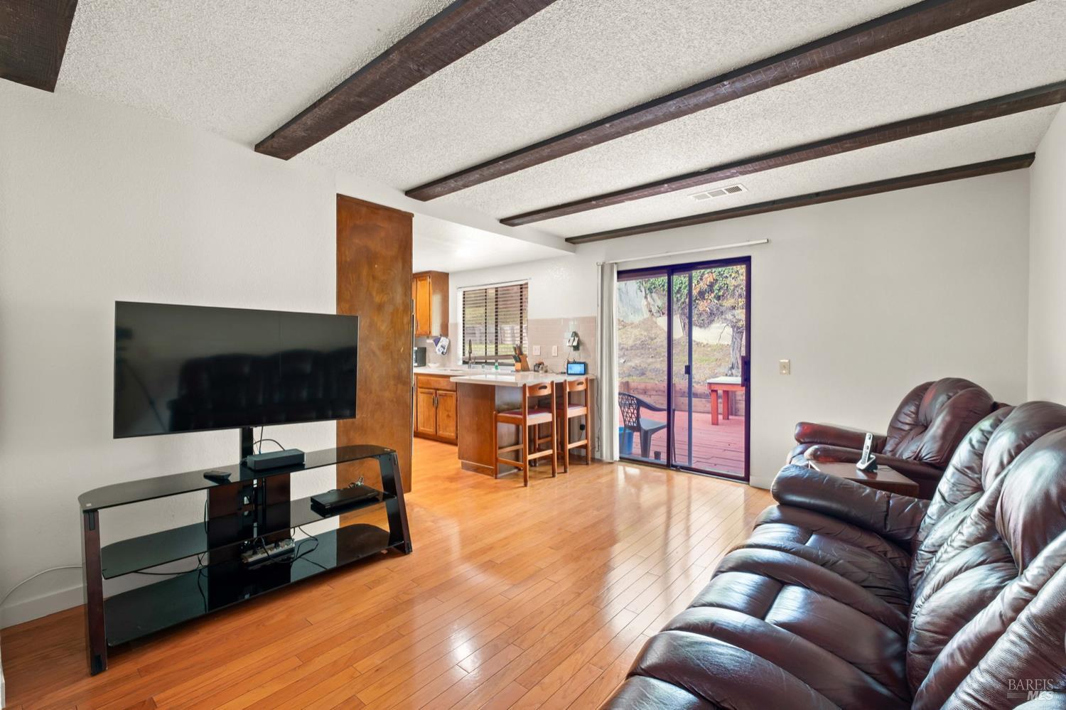 5044 Santa Rita Road El Sobrante, CA 94803 - Photo 13 of 27 a living room with furniture and a flat screen tv