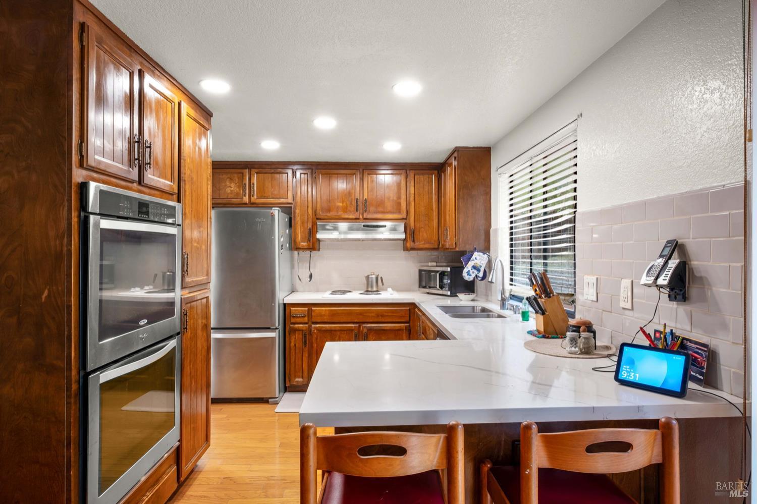 5044 Santa Rita Road El Sobrante, CA 94803 - Photo 7 of 27 a kitchen with granite countertop lots of counter top space and refrigerator