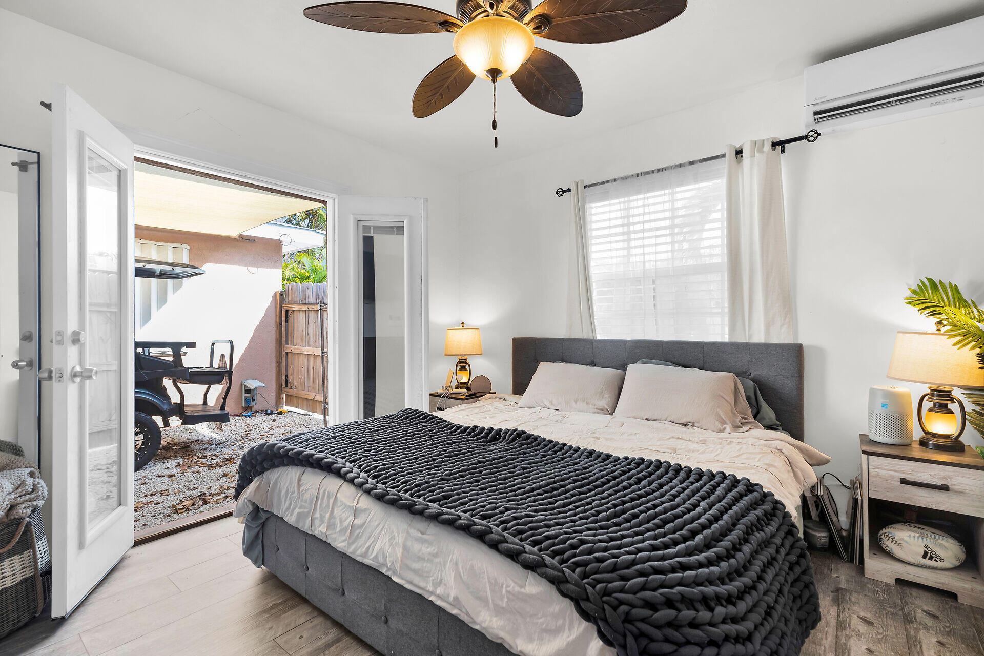 1119 Simonton Street, Unit A2 & C1 Key West, FL 33040 - Photo 11 of 20 a bedroom with a bed and a chandelier