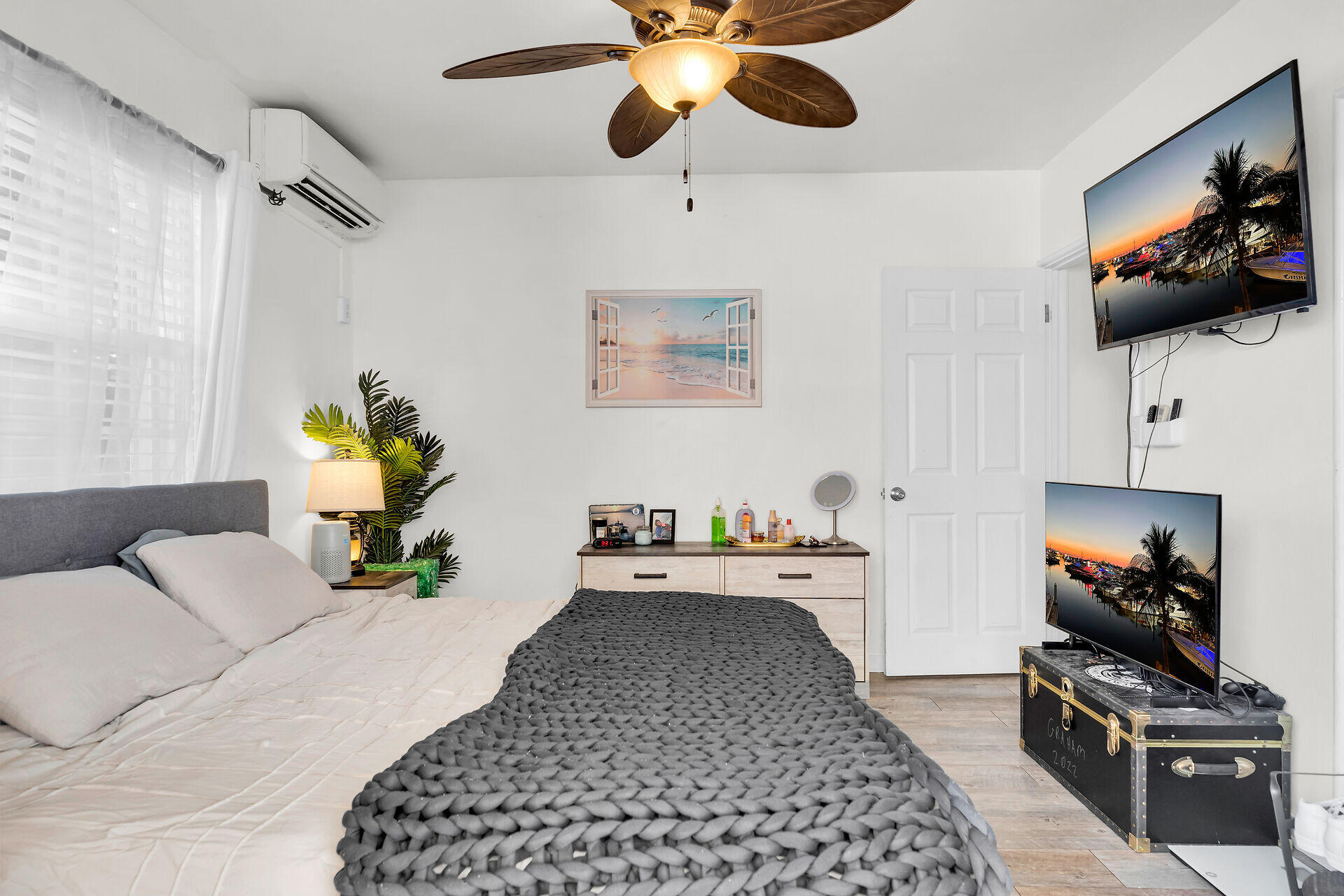 1119 Simonton Street, Unit A2 & C1 Key West, FL 33040 - Photo 12 of 20 a bedroom with a bed and a flat screen tv