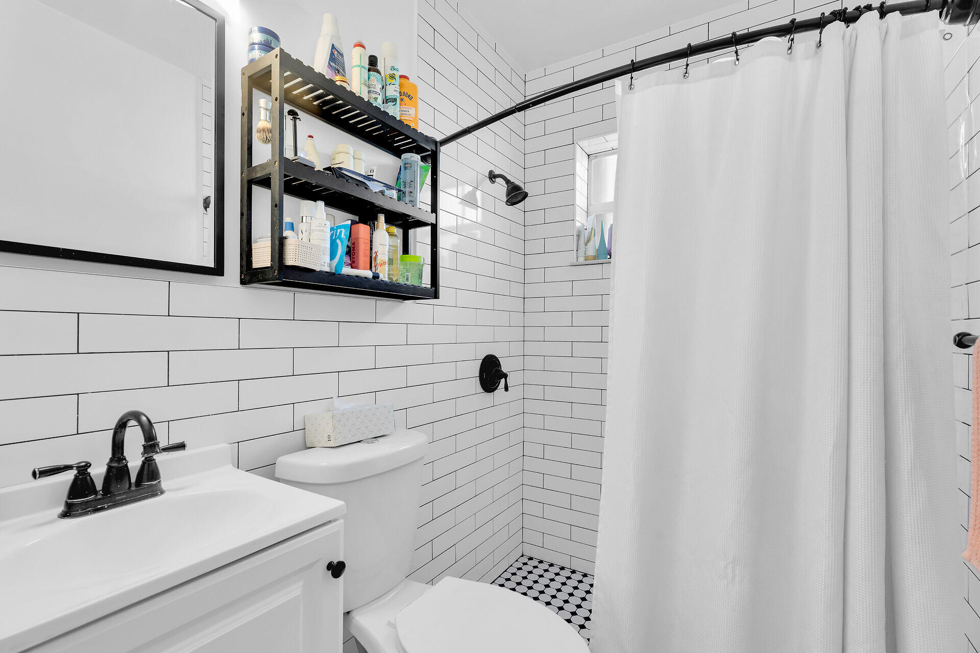 1119 Simonton Street, Unit A2 & C1 Key West, FL 33040 - Photo 14 of 20 a bathroom with a sink a toilet and a shower curtain